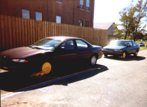 Cars wearing stylin' new wheel boots